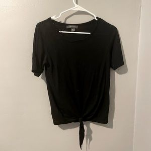 Black short sleeve top with a front tie